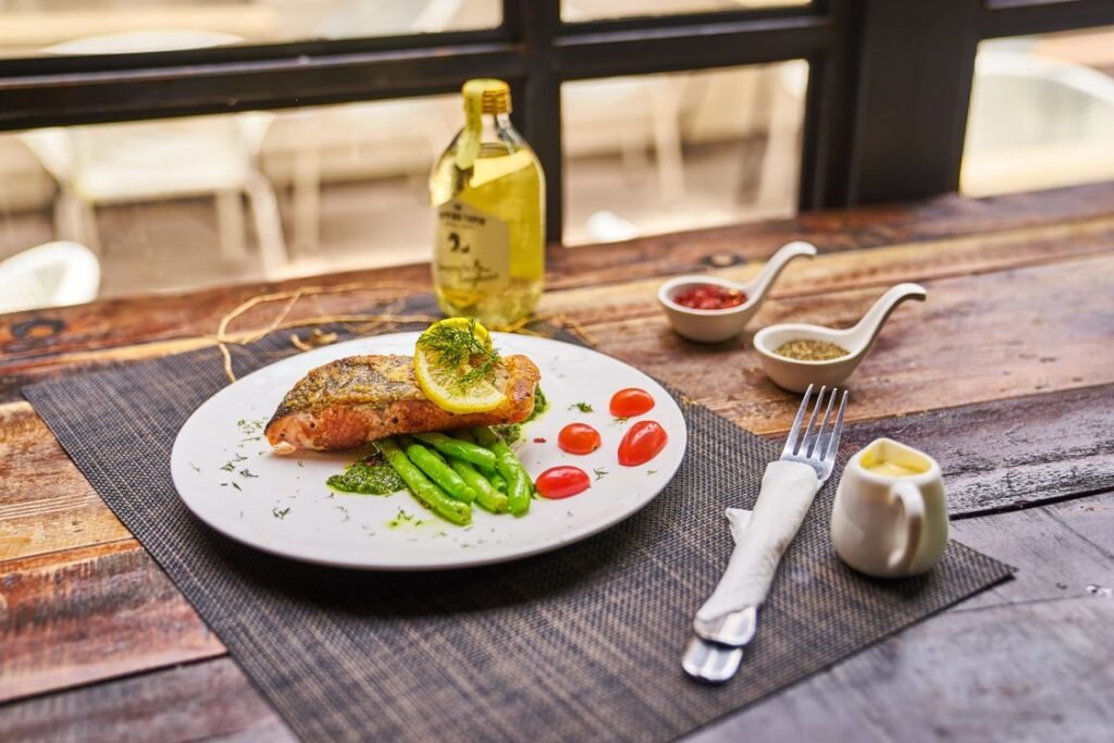 Grilled salmon with asparagus and tomatoes, a paleo meal plan dinner